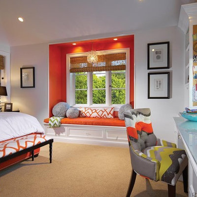 Example of a classic carpeted bedroom design in Orange County with orange walls