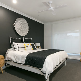 This is an example of a contemporary bedroom in Adelaide with white walls, carpet, no fireplace and grey floor.