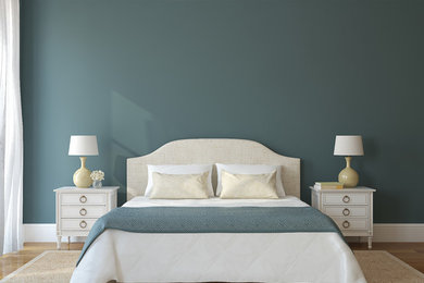 Ejemplo de dormitorio principal actual grande con paredes verdes, suelo de madera clara y suelo marrón