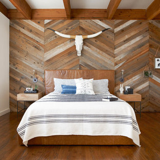 Bedroom - southwestern master dark wood floor bedroom idea in San Francisco with white walls