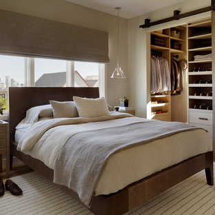 This is an example of a contemporary bedroom in San Francisco with beige walls.