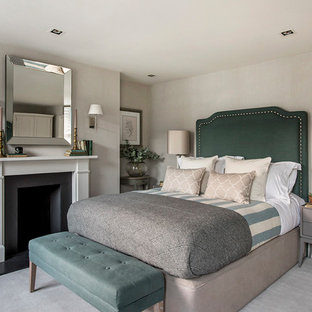 Design ideas for a classic bedroom with grey walls, carpet, a standard fireplace and grey floors.