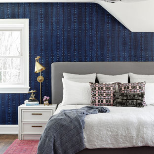 Foto de dormitorio tradicional renovado con paredes azules, suelo de madera oscura y suelo marrón