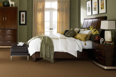 Inspiration for a mid-sized master carpeted bedroom remodel in San Diego with green walls