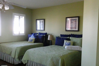 Example of a trendy master bedroom design in Tampa with green walls