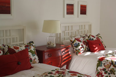 Example of an island style guest bedroom design in Other