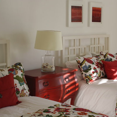 Example of an island style guest bedroom design in Other