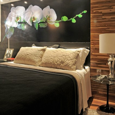 Inspiration for a contemporary medium tone wood floor bedroom remodel in Other with black walls