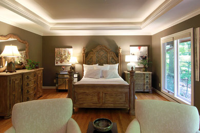 Bedroom - mid-sized transitional master medium tone wood floor bedroom idea in Other with gray walls, a standard fireplace and a stone fireplace