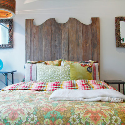 Eclectic bedroom photo in Austin with white walls
