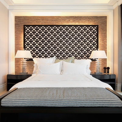 Example of a transitional bedroom design in Austin with beige walls