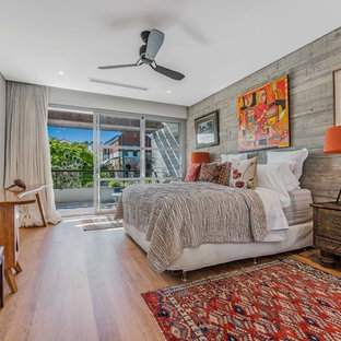 Asian master bedroom in Perth with grey walls, medium hardwood floors and beige floor.
