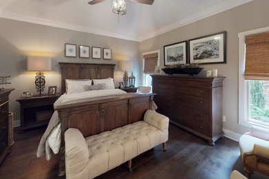 Example of a small transitional master dark wood floor and brown floor bedroom design in Other with gray walls and no fireplace
