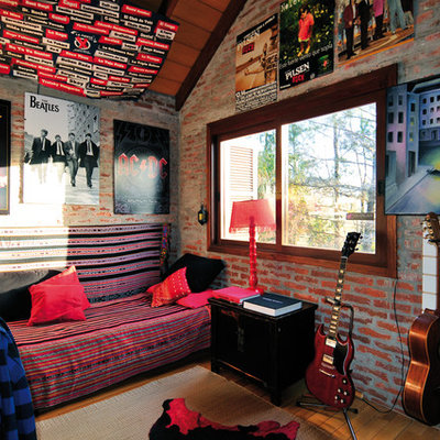 Eclectic medium tone wood floor bedroom photo in Other with no fireplace