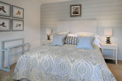 Design ideas for a small contemporary guest bedroom in London with white walls and carpet.