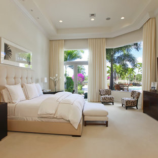 Bedroom - traditional beige floor bedroom idea in Miami with beige walls