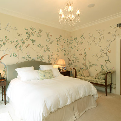 Elegant carpeted bedroom photo in London with multicolored walls