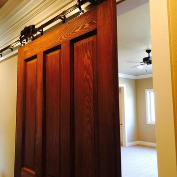 Restored farmhouse door with original antique pocket door sliders