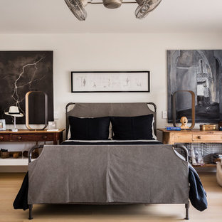 Example of a large urban master light wood floor and beige floor bedroom design in Chicago with white walls and no fireplace