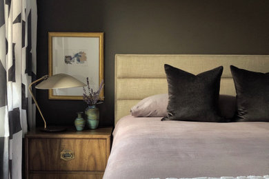 Inspiration for a contemporary master bedroom remodel in Chicago with brown walls