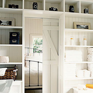 room dividers, pocket door, barn doors, open shelving storage, bedrooms, white