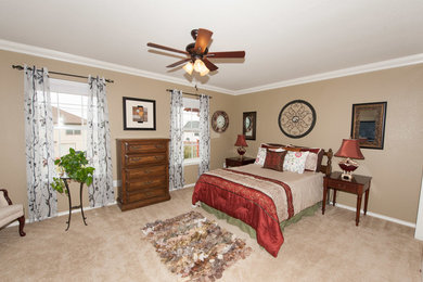 Mid-sized elegant guest carpeted bedroom photo in Austin with beige walls