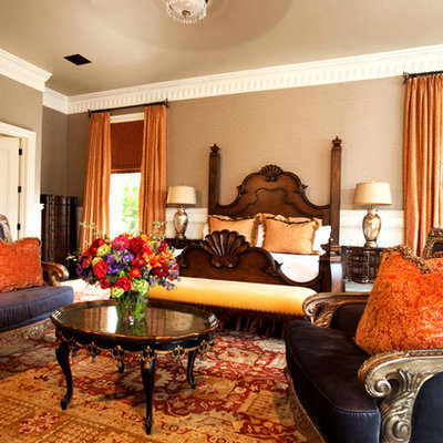 Example of an eclectic bedroom design in Phoenix with beige walls