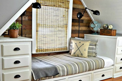 Bedroom - small country loft-style medium tone wood floor bedroom idea in Charlotte with gray walls