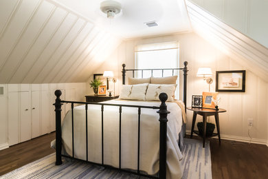 Inspiration for a small country medium tone wood floor bedroom remodel in Other with white walls and no fireplace