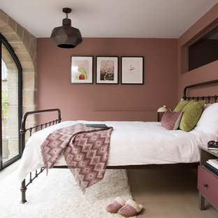Design ideas for a medium sized rustic bedroom in Other with pink walls, light hardwood flooring and beige floors.