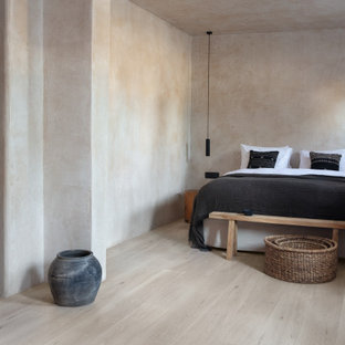 Modelo de dormitorio rural con suelo laminado y suelo gris