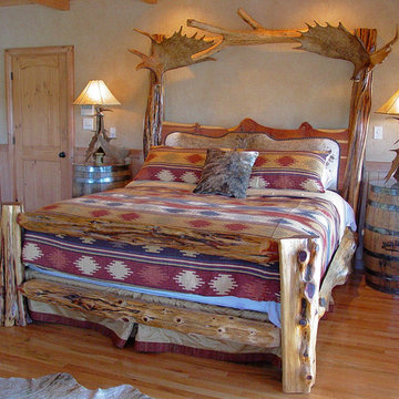 Rustic Log Bed with Brindle Cowhide Headboard and Moose Antler