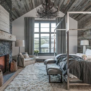 Rustic Master Bedroom With Stone Fireplace