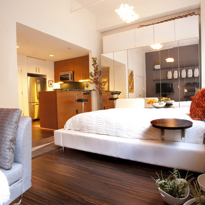 Minimalist dark wood floor bedroom photo in San Francisco with beige walls
