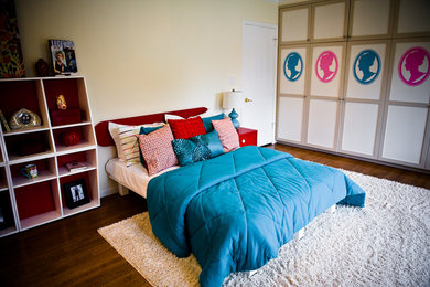 Inspiration for a large modern medium tone wood floor bedroom remodel in Los Angeles with beige walls and no fireplace