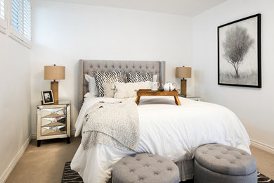 Inspiration for a master bedroom remodel in Los Angeles with white walls