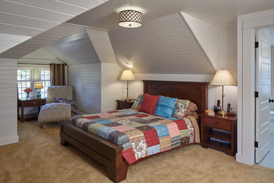 This is an example of a medium sized midcentury master bedroom in Portland with carpet.
