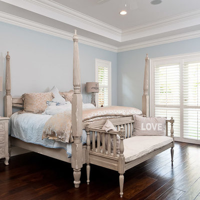 Bedroom - tropical bedroom idea in Miami with blue walls