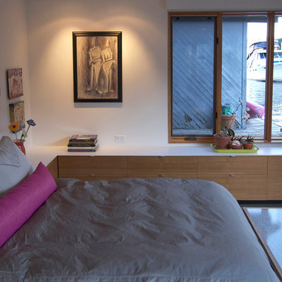 Bedroom - contemporary bedroom idea in Seattle with white walls