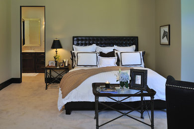 Large elegant guest carpeted bedroom photo in Houston with beige walls