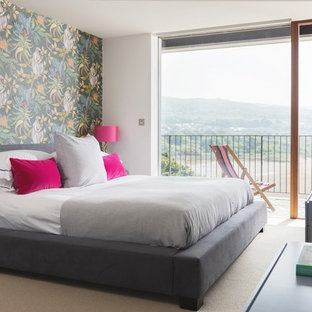 Design ideas for a medium sized contemporary bedroom in Other with white walls, carpet and beige floors.