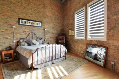 Inspiration for an industrial bedroom remodel in Chicago