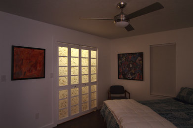 Example of a minimalist bedroom design in Other