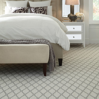 Inspiration for a large transitional master carpeted bedroom remodel in New York with gray walls