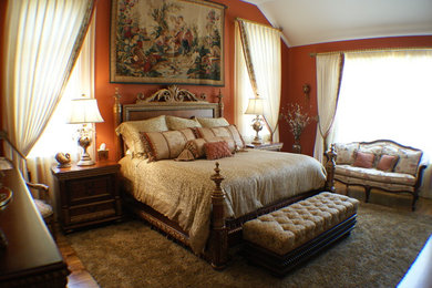 Example of a mid-sized classic master carpeted bedroom design in Chicago with no fireplace and orange walls