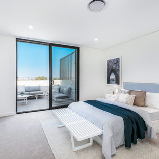 Design ideas for a contemporary master bedroom in Sydney with white walls, carpet, no fireplace and grey floor.