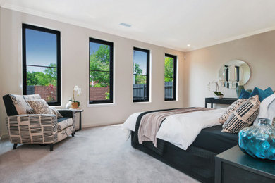 Aluminium Awning Windows with black frames in a bedroom
