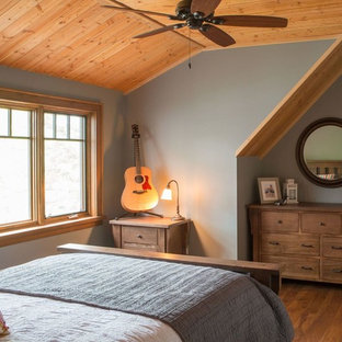 Mid-sized arts and crafts bedroom in Toronto with grey walls, medium hardwood floors and no fireplace.