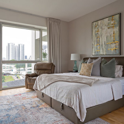 Bedroom - contemporary light wood floor and beige floor bedroom idea in Singapore with beige walls