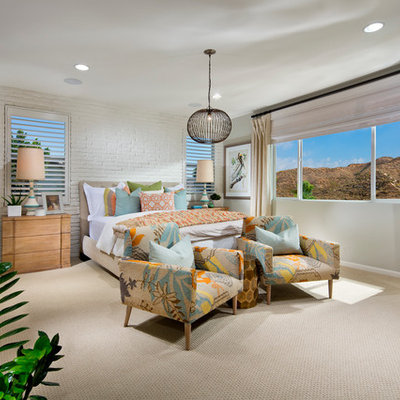 Inspiration for a tropical carpeted bedroom remodel in Orange County with gray walls